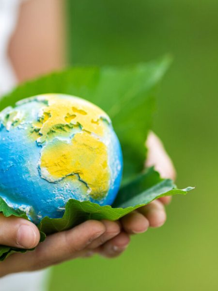 kid-holding-small-planet-in-hands-against-spring-o-2026-03-11-02-12-18-utc